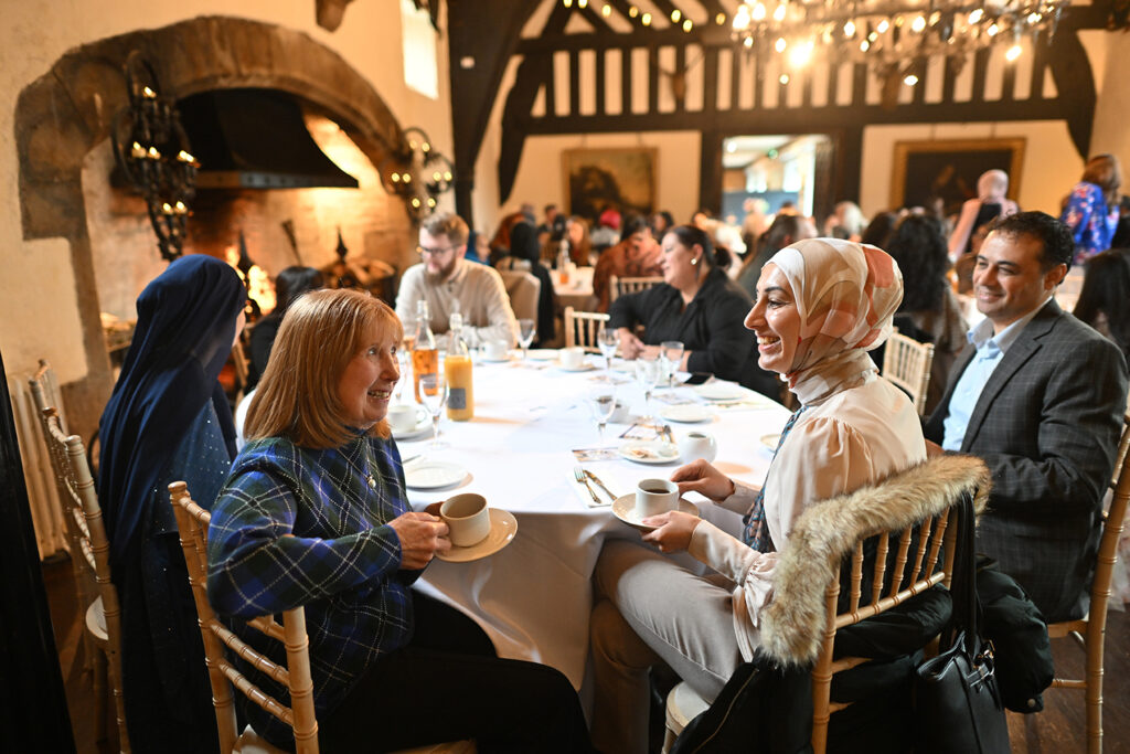 Guests enjoying One Voice Blackburn Afternoon Tea at Samlesbury Hall 2025